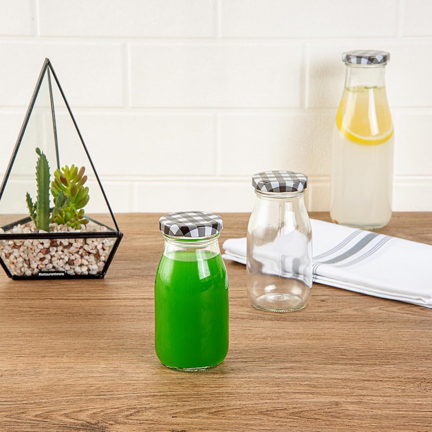 Restaurantware-French Countryside 6 Ounce Glass Bottles, 10 Durable Juice Bottles - With Black Plaid Lid, Dishwashable, Clear Glass Countryside Bottle, For Hot And Cold Beverages